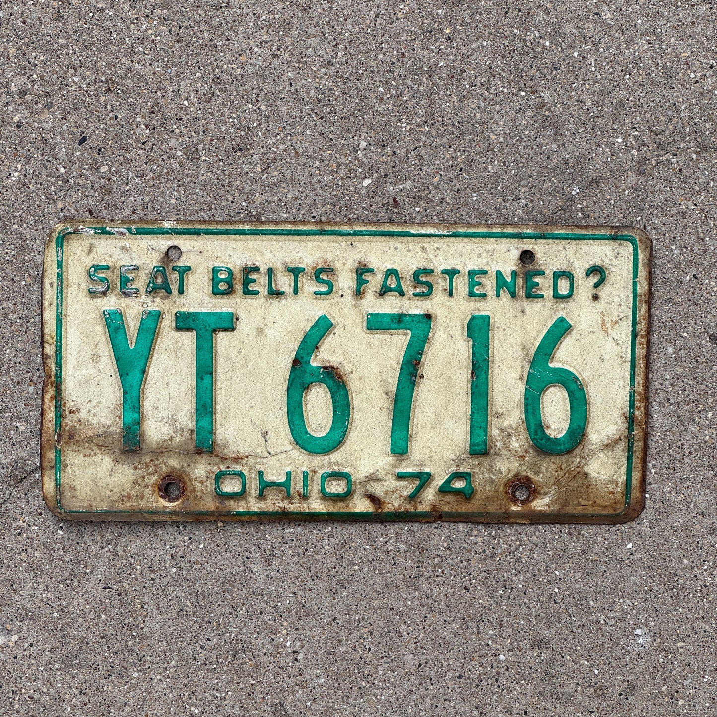 Photo of a 1974 Ohio License Plate Auto Tag Garage Decor Vintage YT 6716 with original patina