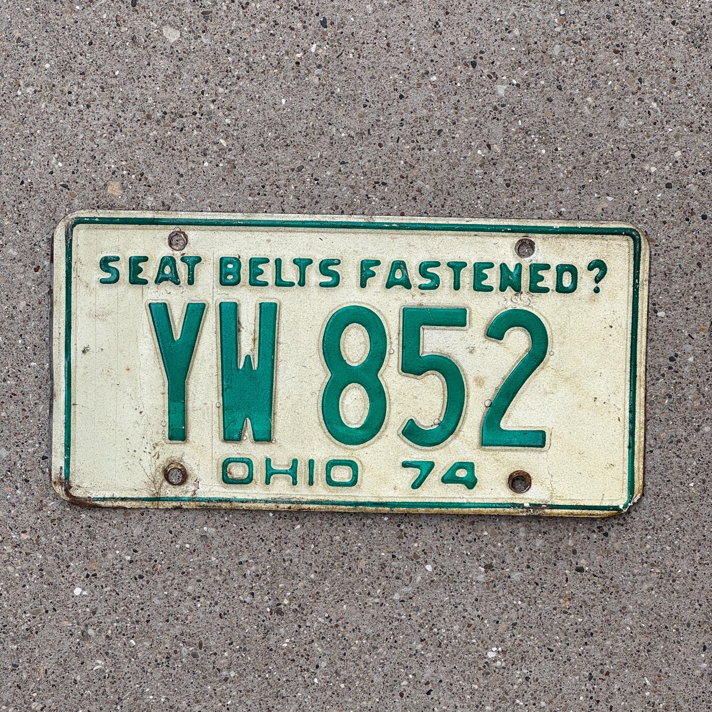 Photo of a 1974 Ohio License Plate Auto Tag Garage Decor Vintage YW 852 with original patina