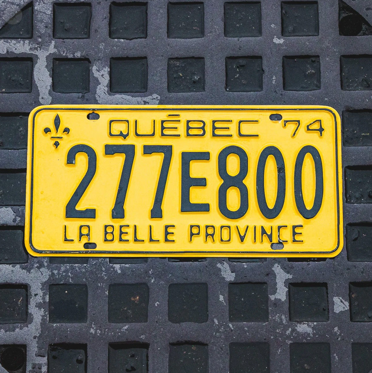 Photo of a 1974 Quebec License Plate Auto Tag Garage Decor Vintage 277 E 800 with original patina