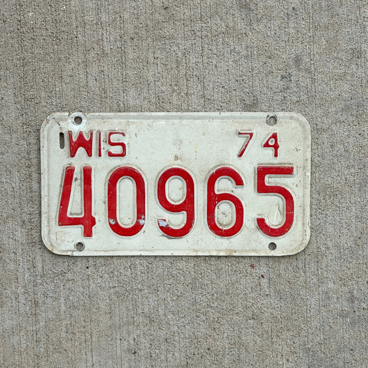 Photo of a 1974 Wisconsin Motorcycle License Plate Auto Tag Garage Decor Vintage 40965 with original patina