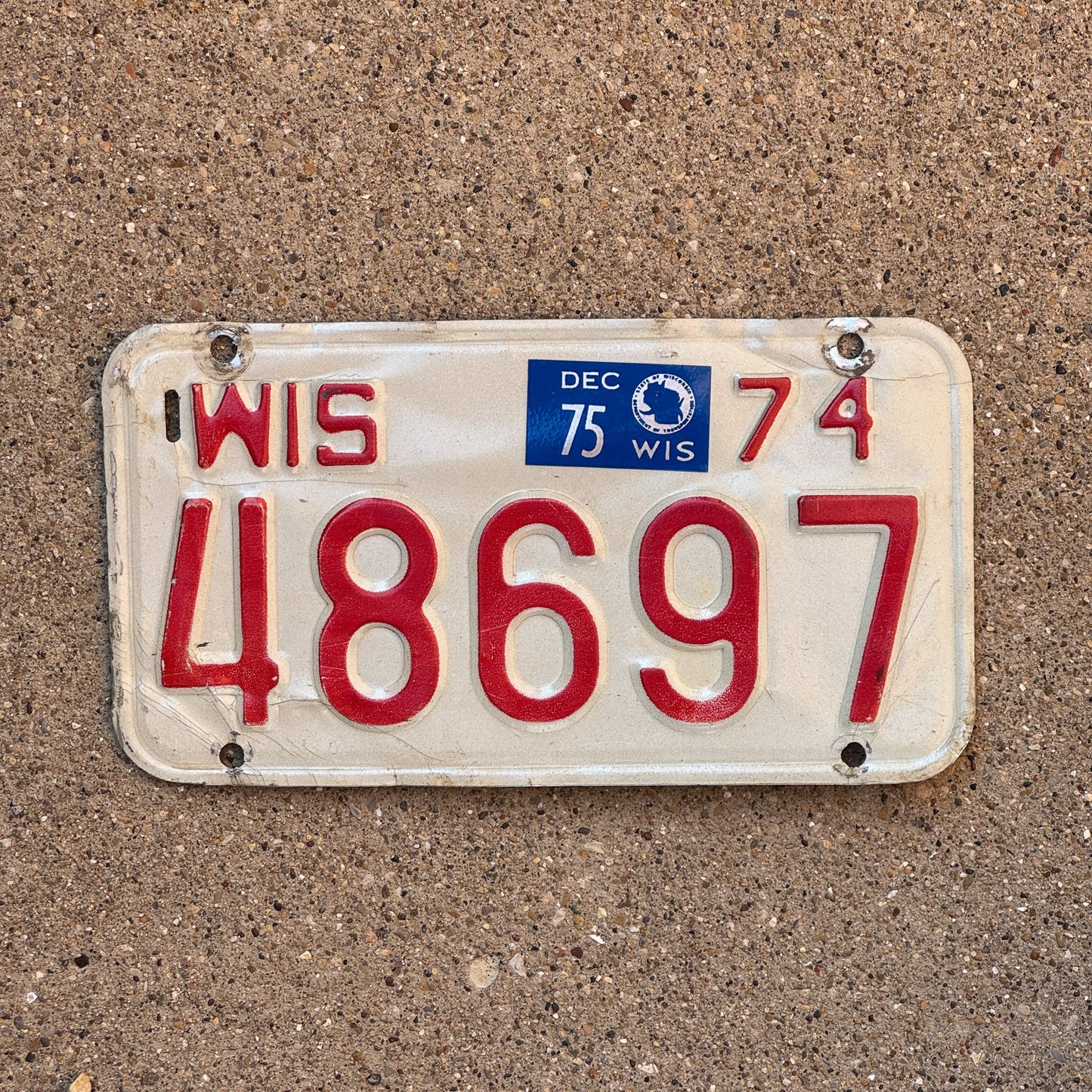 Photo of a 1975 1975 Wisconsin Motorcycle License Plate Auto Tag Garage Decor Vintage 48697