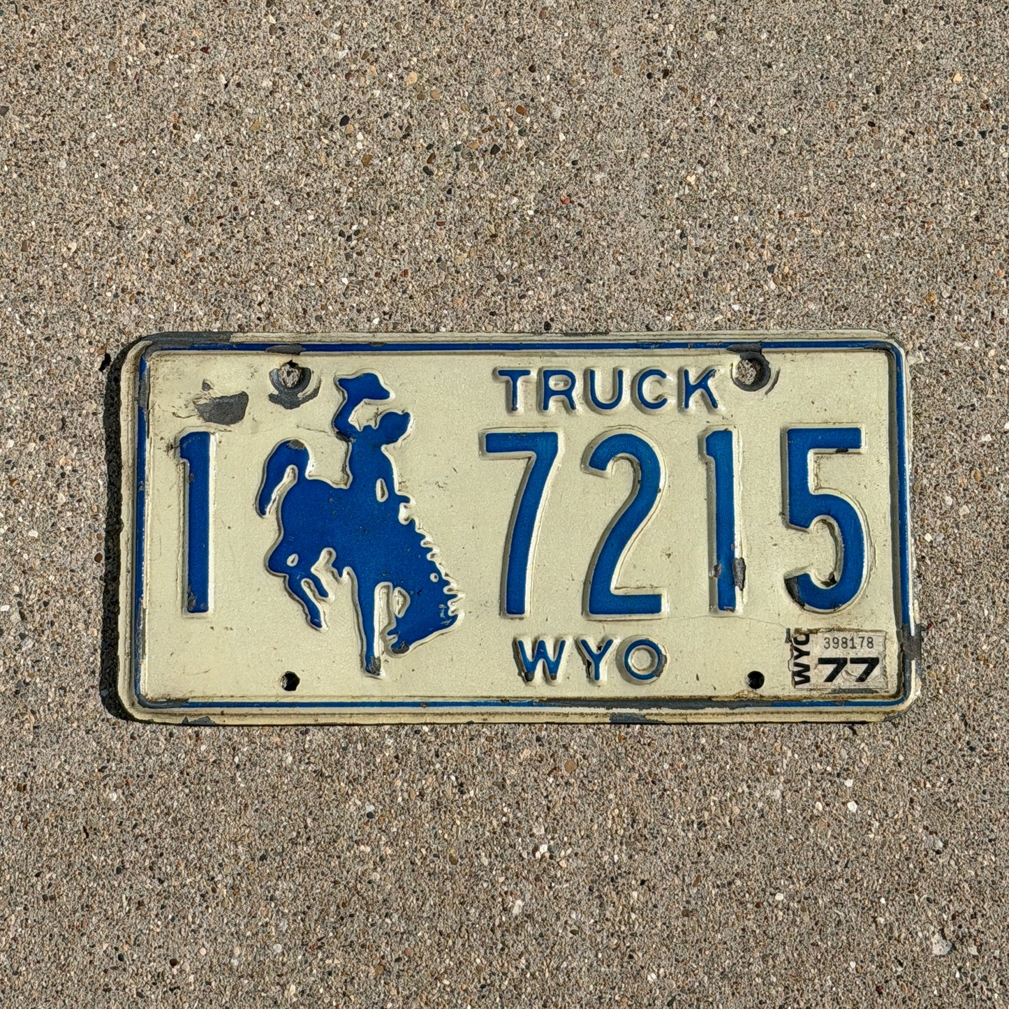 Photo of a 1975 1977 Wyoming Truck License Plate Auto Tag Garage Decor Vintage Cowboy Rodeo 1 7215 with original patina