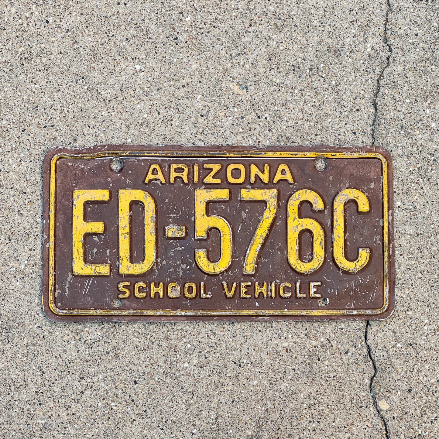 Photo of a 1975 Arizona School Vehicle License Plate Auto Tag Garage Decor Vintage Education ED 576C with original patina