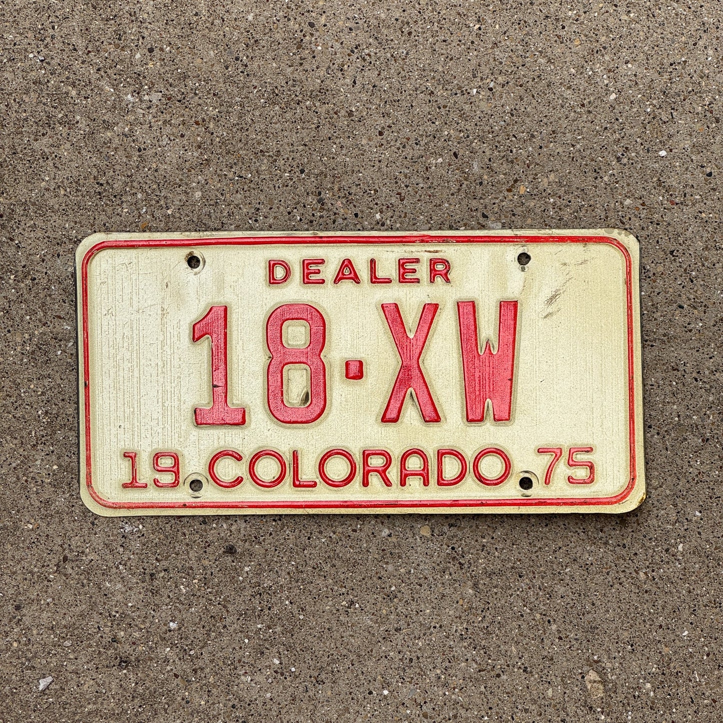 Photo of a 1975 Colorado Dealer License Plate Auto Tag Garage Decor Vintage 18 XW