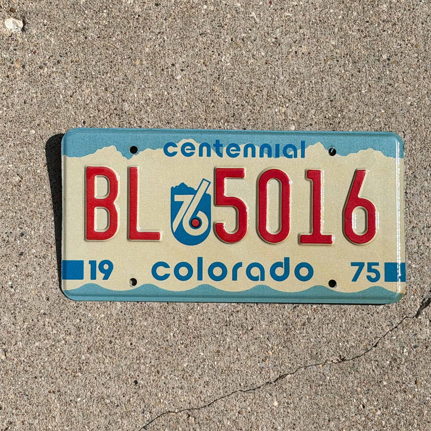Photo of a 1975 Colorado License Plate Auto Tag Garage Decor Vintage Bicentennial BL 5016 with original patina