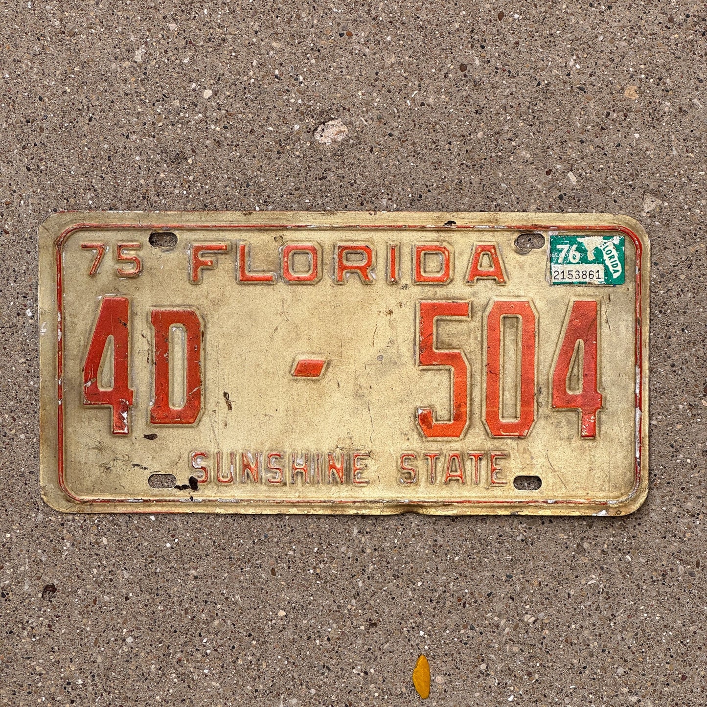 Photo of a 1975 Florida License Plate Auto Tag Garage Decor Vintage 4 D 504 with original patina