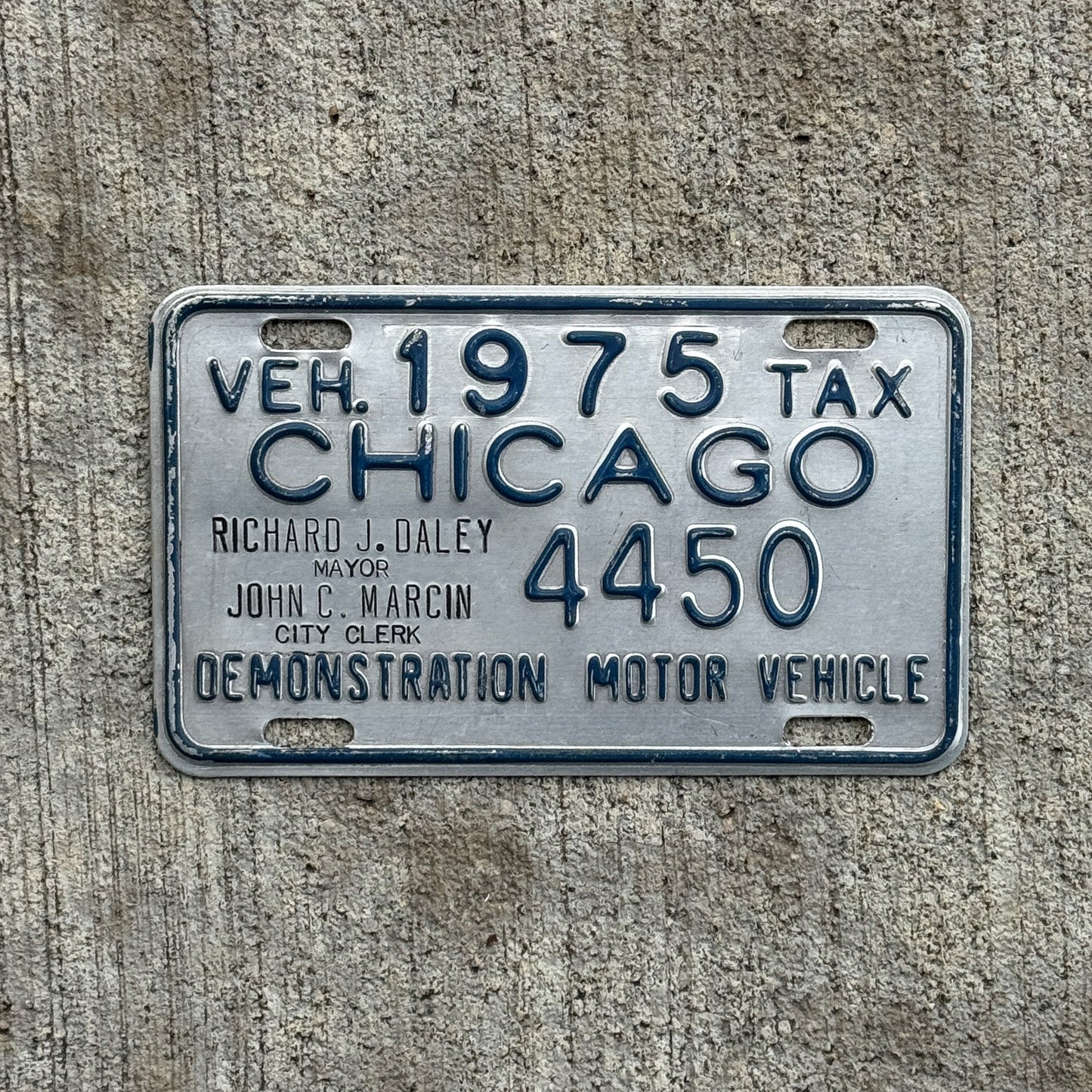 Photo of a 1975 Illinois Chicago Dealer Tax Tag Auto Tag Garage Decor Vintage 4450 with original patina