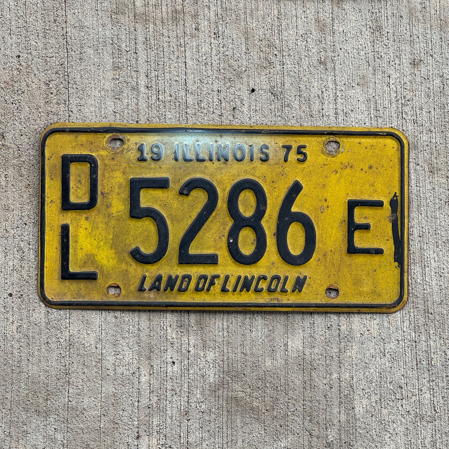 Photo of a 1975 Illinois Dealer License Plate Auto Tag 2 Vintage Garage 5286 E with original patina