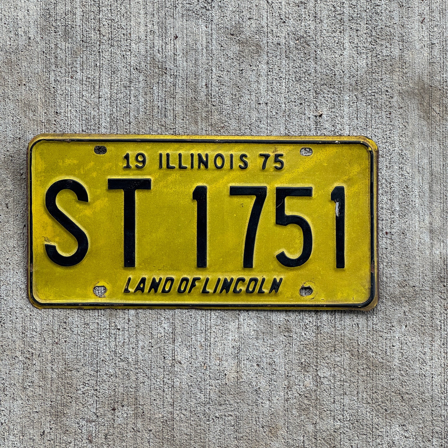Photo of a 1975 Illinois License Plate Auto Tag 1 Vintage Garage ST 1751 with original patina