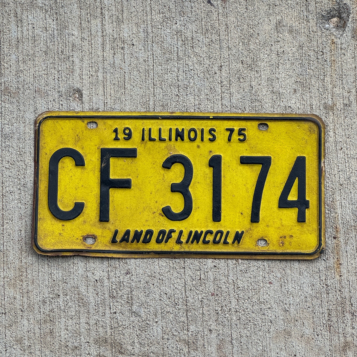 Photo of a 1975 Illinois License Plate Auto Tag 2 Vintage Garage CF 3174 with original patina