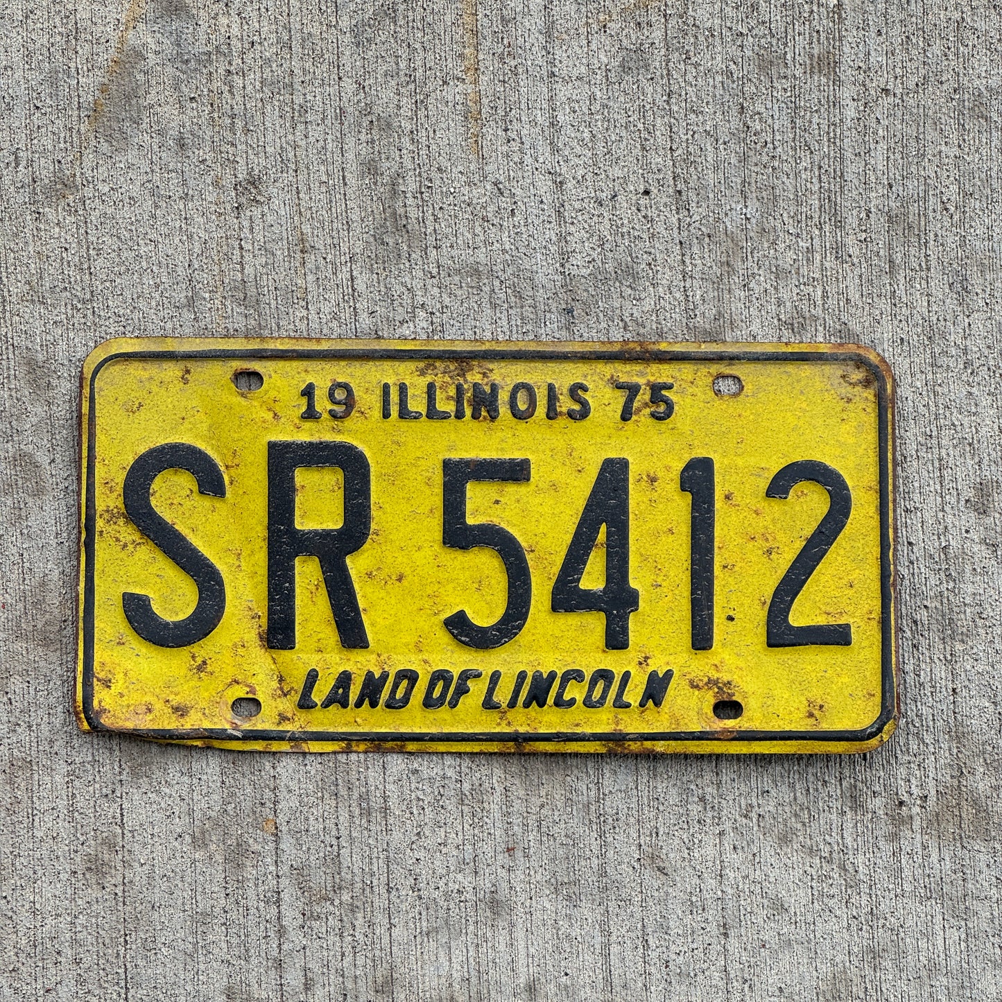 Photo of a 1975 Illinois License Plate Auto Tag 2 Vintage Garage SR 5412 with original patina