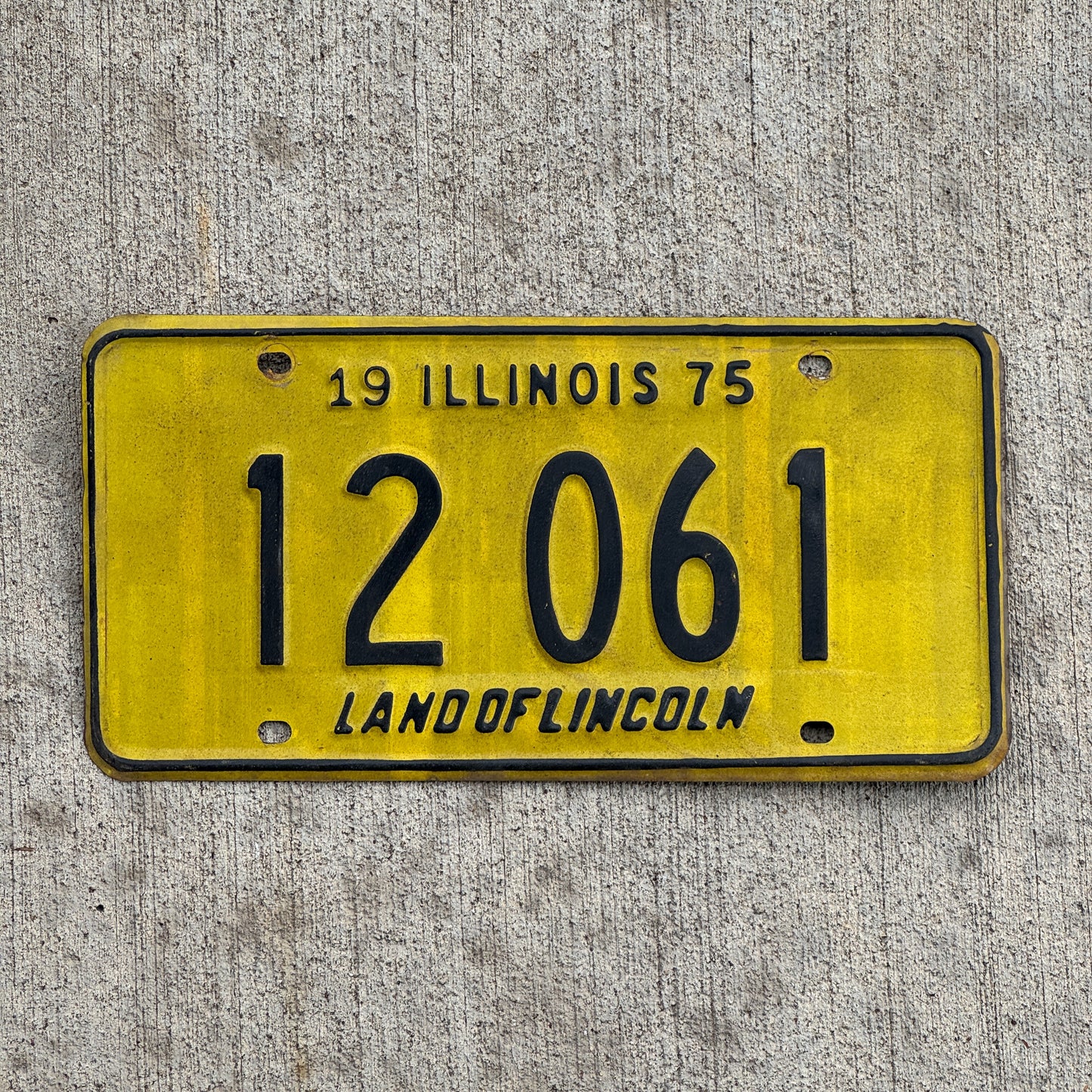 Photo of a 1975 Illinois License Plate Auto Tag Garage Decor Vintage 12 061 with original patina