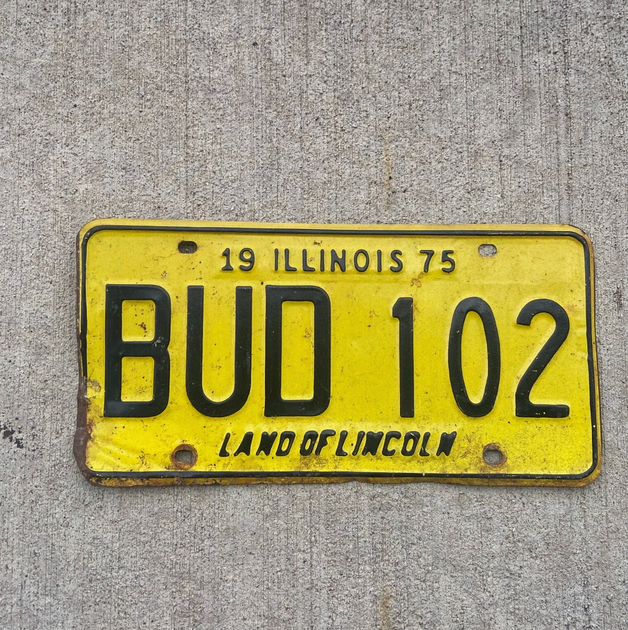 Photo of a 1975 Illinois License Plate Auto Tag Garage Decor Vintage 420 Weed Pot Smoke BUD 102 with original patina