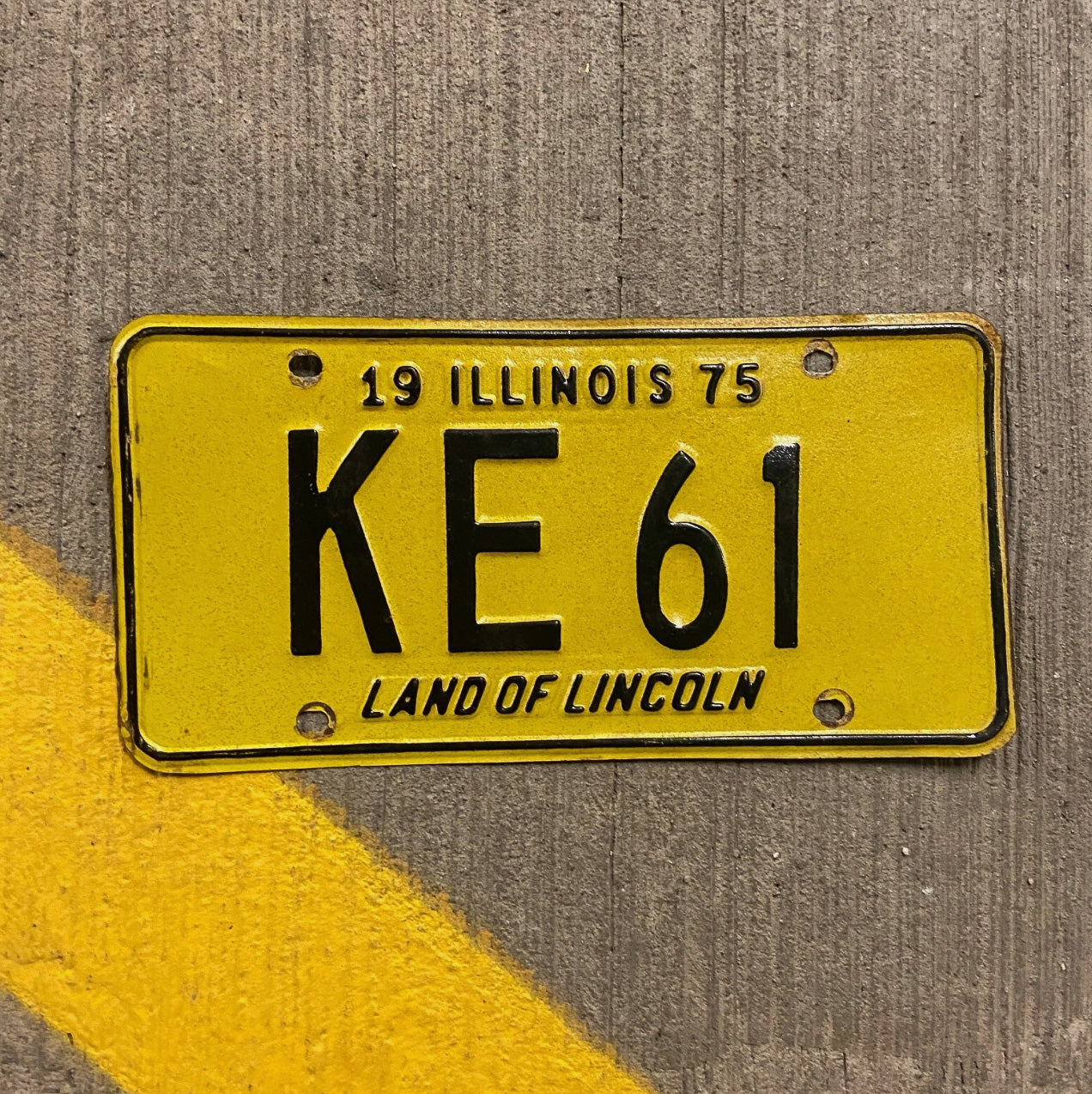 Photo of a 1975 Illinois License Plate Auto Tag Garage Decor Vintage KE 61 with original patina