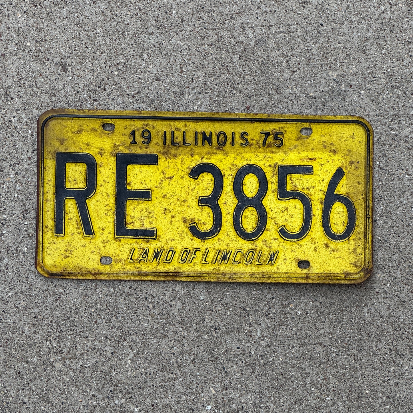 Photo of a 1975 Illinois License Plate Auto Tag Garage Decor Vintage RE 3856 with original patina