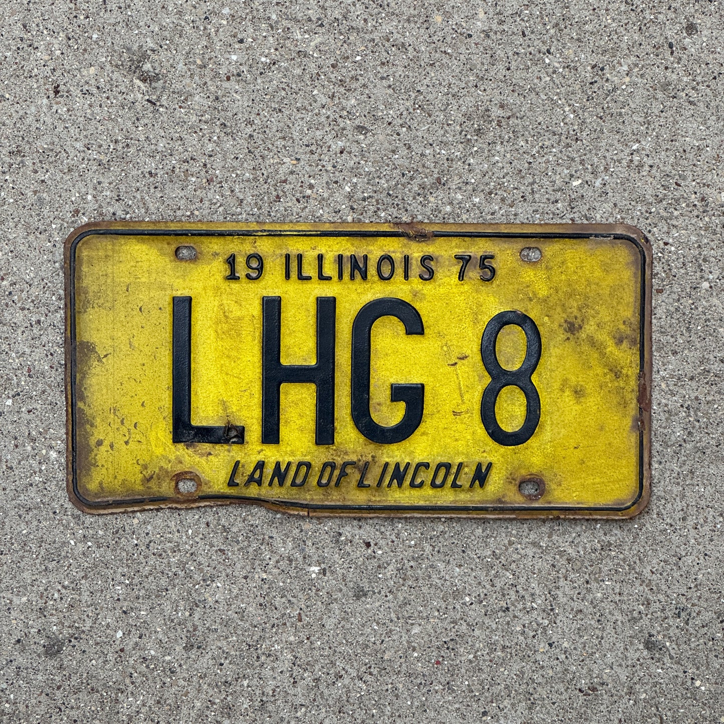 Photo of a 1975 Illinois Vanity License Plate Auto Tag 1 Vintage Garage LHG 8 with original patina