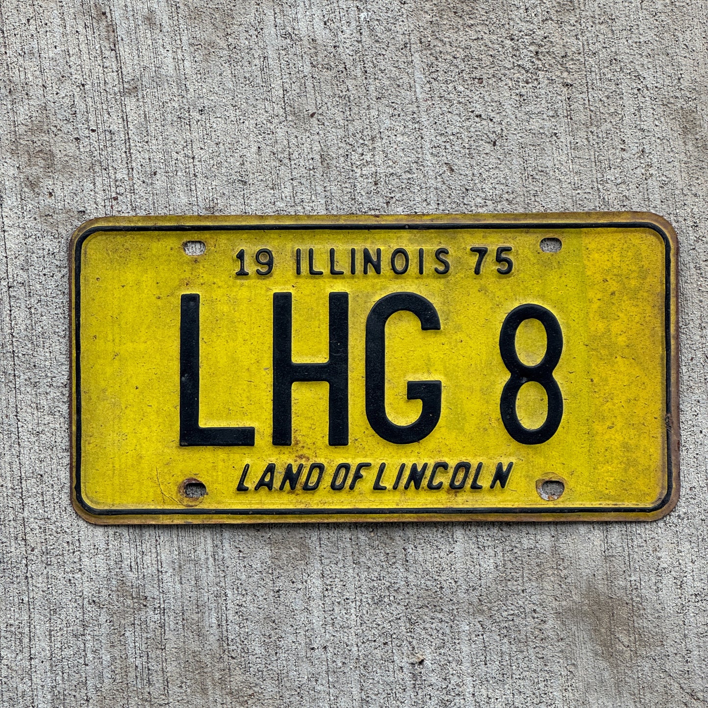 Photo of a 1975 Illinois Vanity License Plate Auto Tag 2 Vintage Garage LHG 8 with original patina