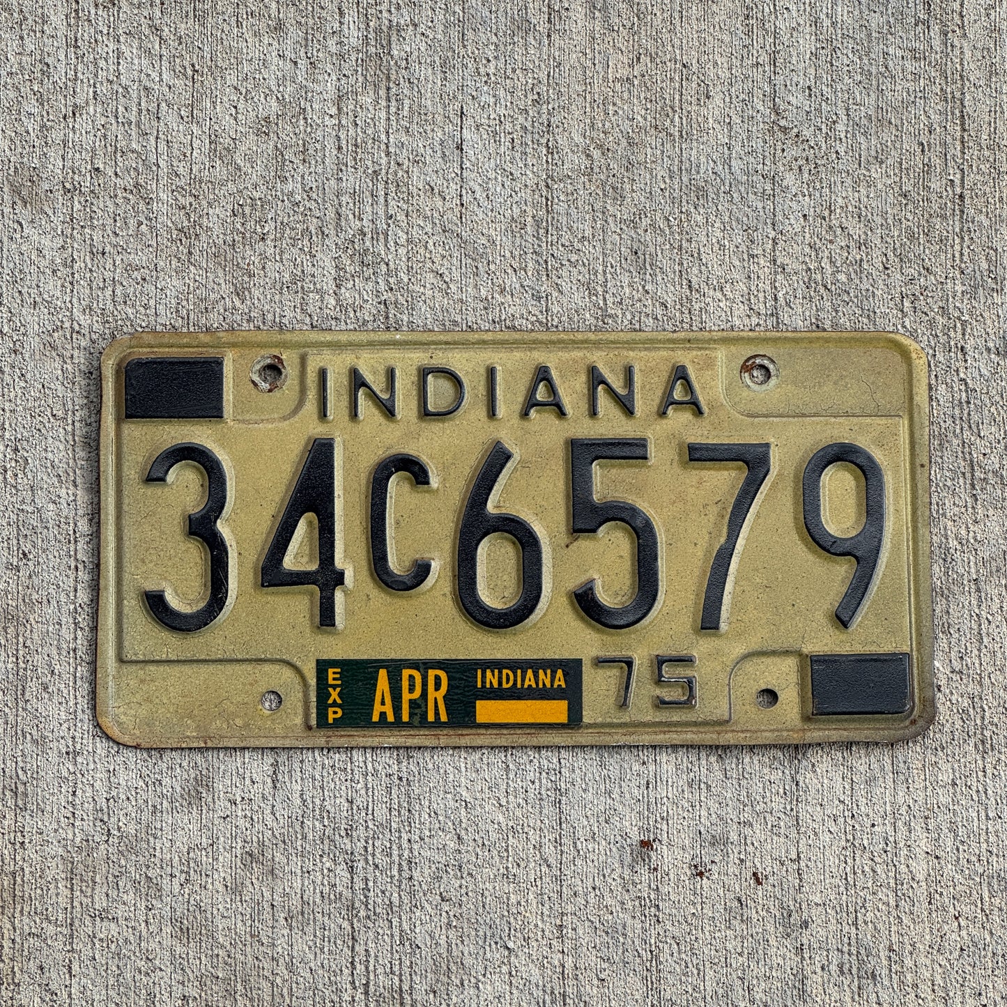 Photo of a 1975 Indiana License Plate Auto Tag Garage Decor Vintage 34 C 6579 with original patina