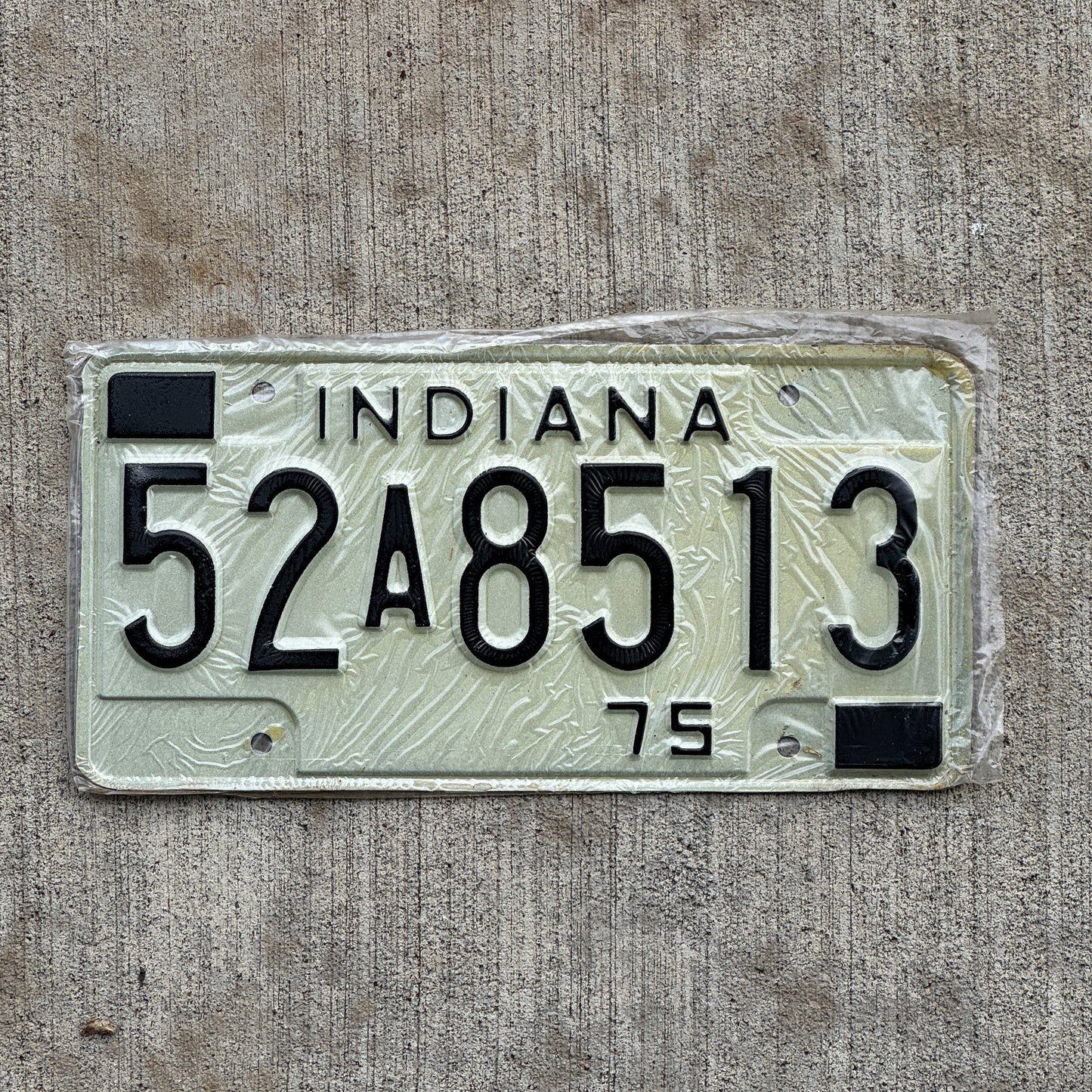 Photo of a 1975 Indiana License Plate Auto Tag Garage Decor Vintage New Old Stock 52 A 8513 with original patina