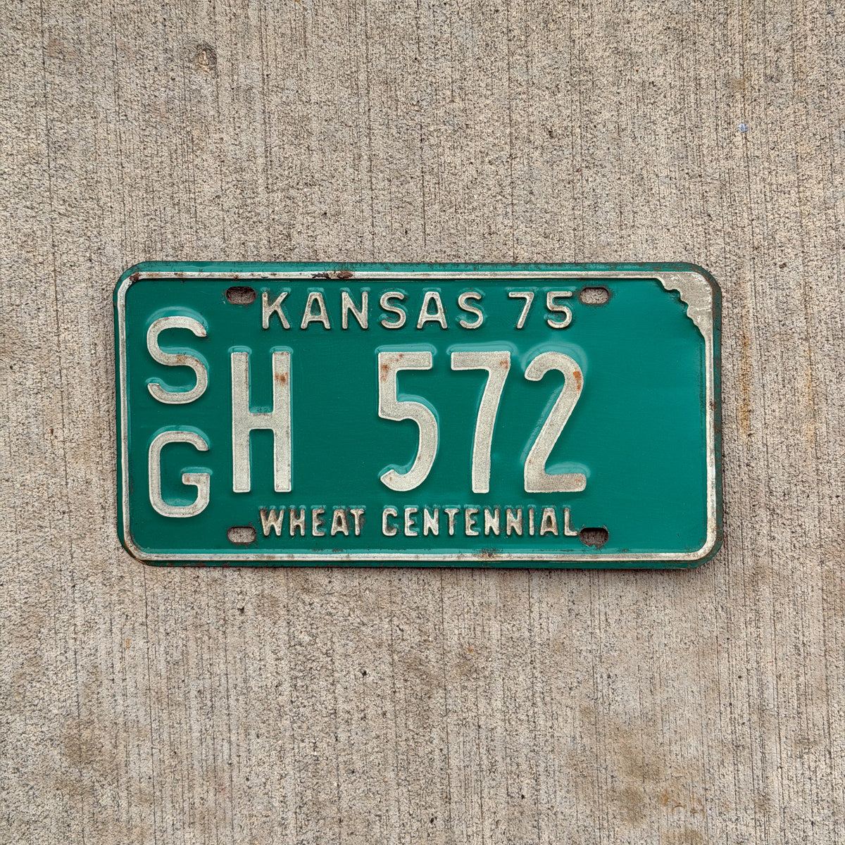 Photo of a 1975 Kansas License Plate Auto Tag Garage Decor Vintage SG H 572 with original patina