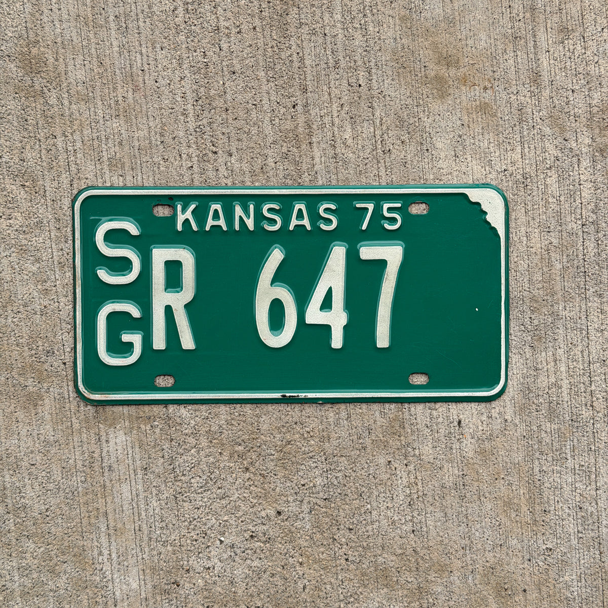Photo of a 1975 Kansas License Plate Auto Tag Garage Decor Vintage SG R 647 with original patina