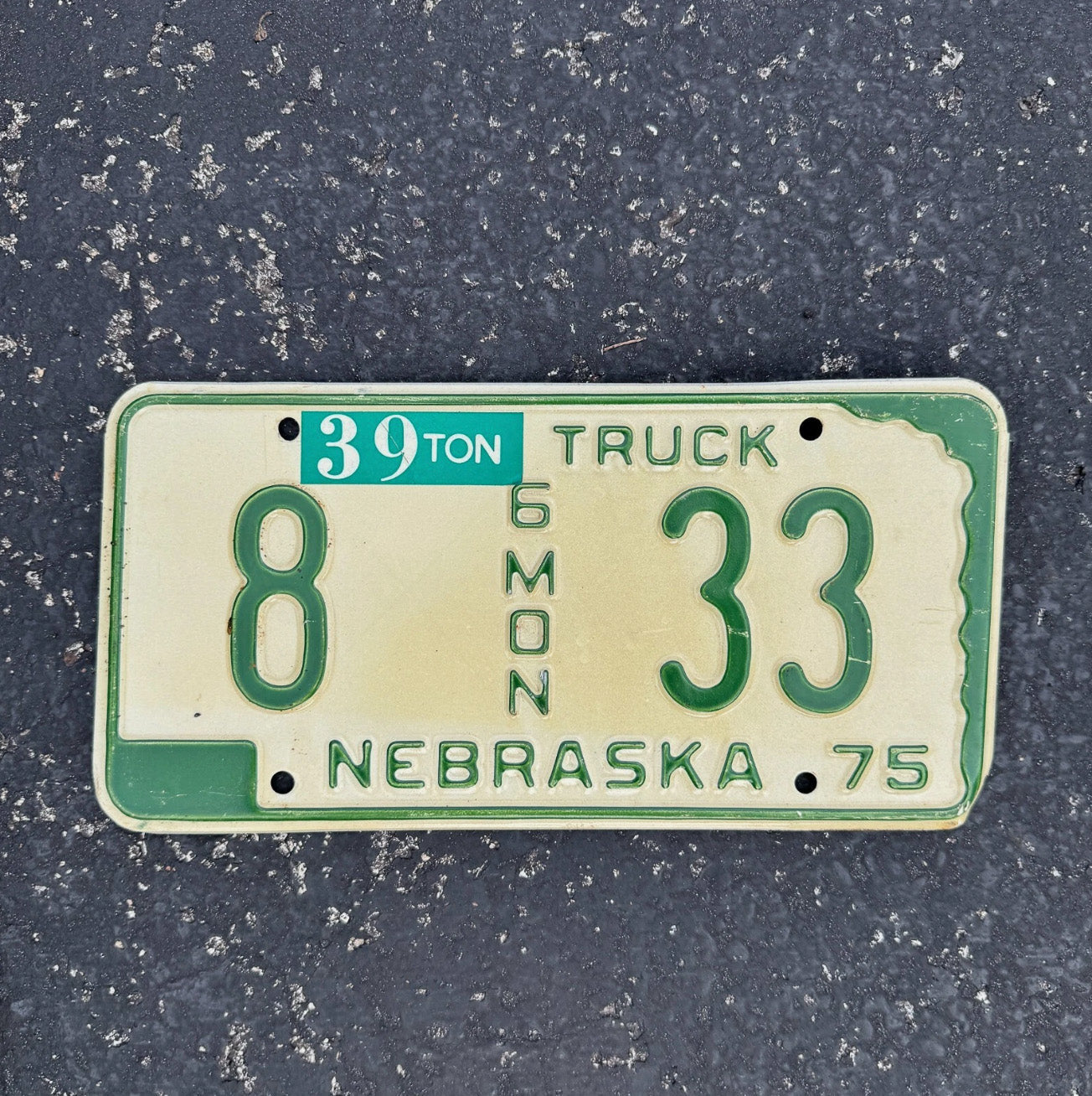 Photo of a 1975 Nebraska Truck License Plate Auto Tag Garage Decor Vintage 6 Month 8 33