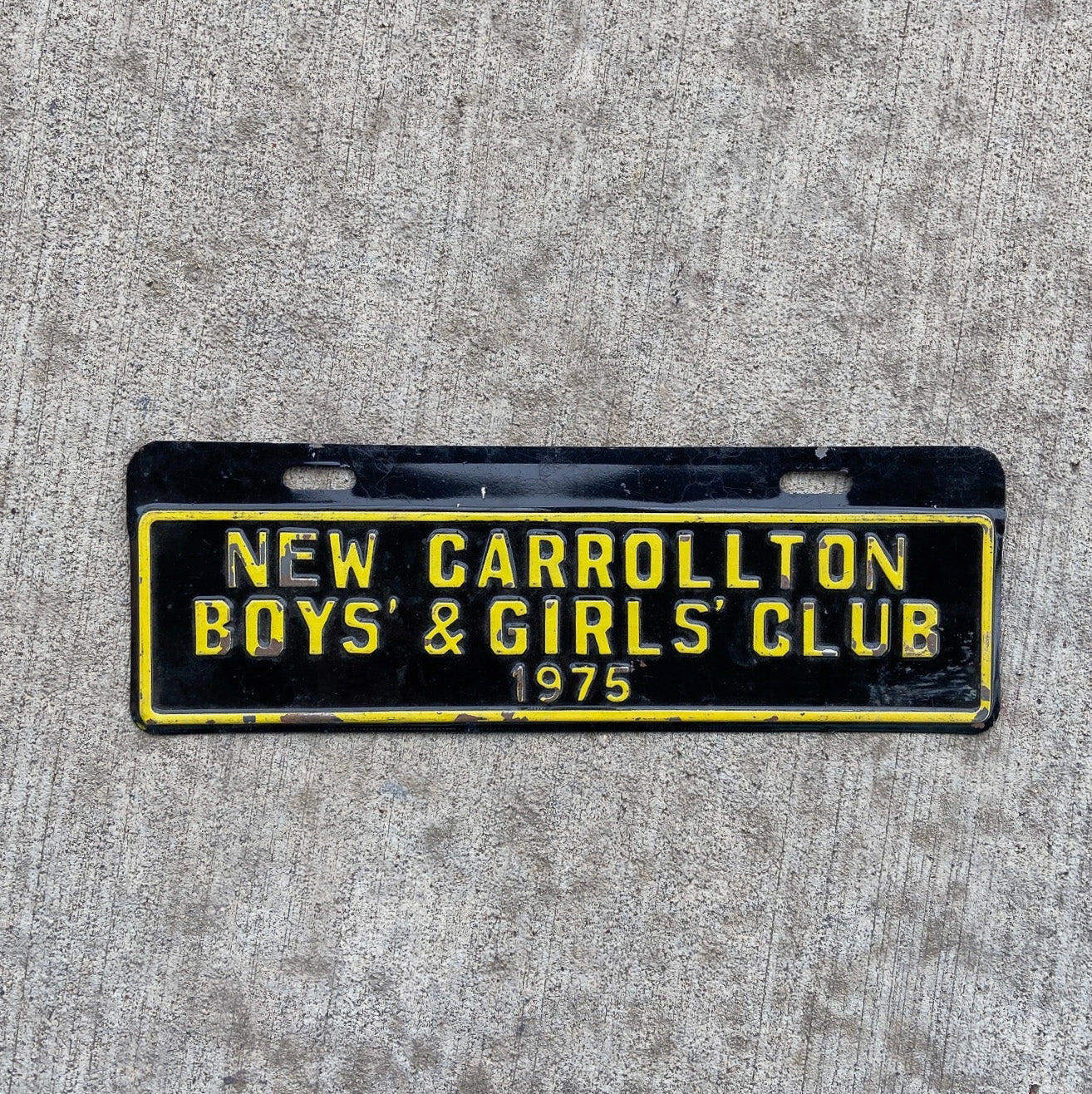 Photo of a 1975 New Carrollton Maryland License Plate Topper Auto Tag Garage Decor Vintage Boys Girls Club Near Washington DC with original patina