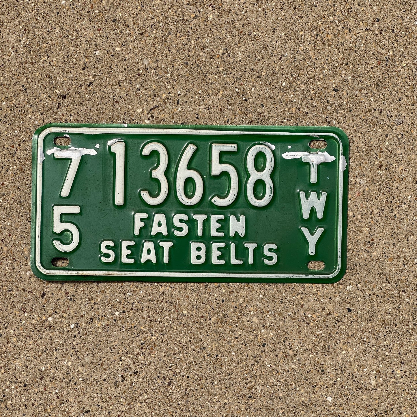 Photo of a 1975 New York Thruway License Plate Auto Tag Garage Decor Vintage 13658