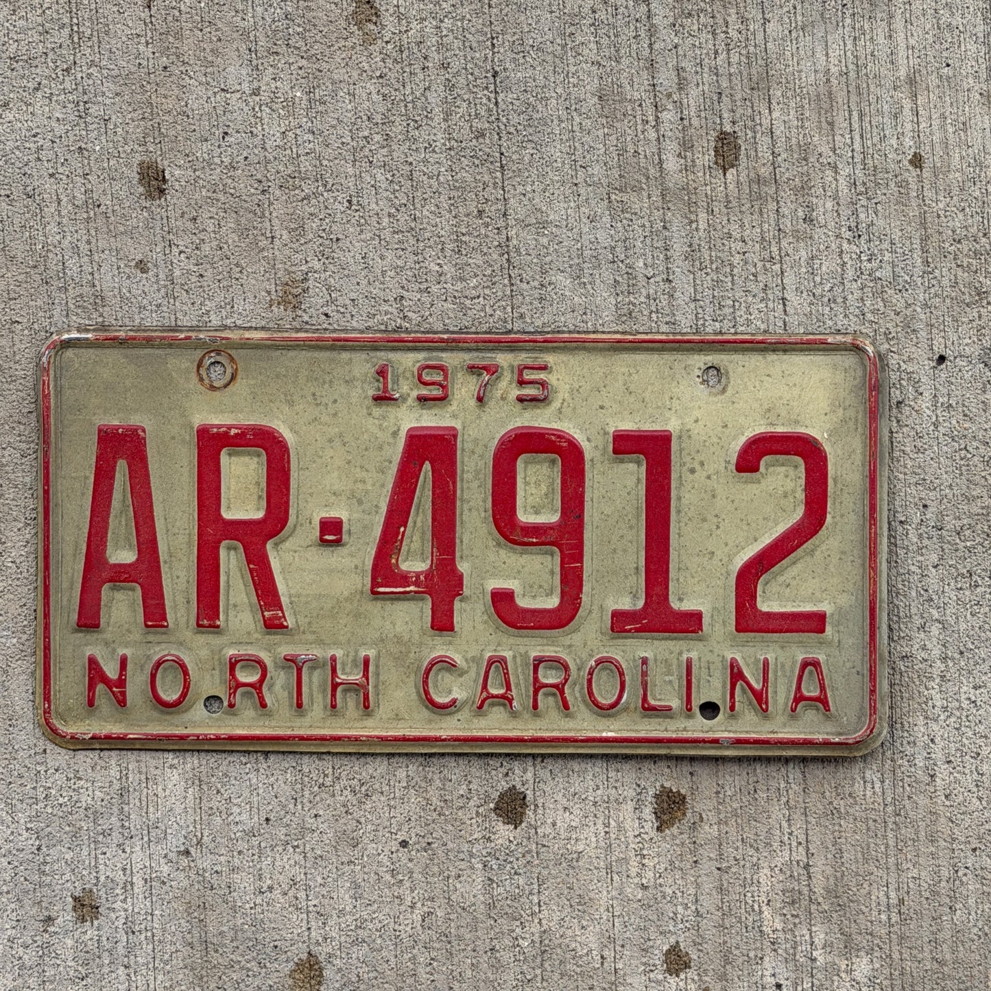 Photo of a 1975 North Carolina Truck License Plate Auto Tag Garage Decor Vintage AR 4912 with original patina