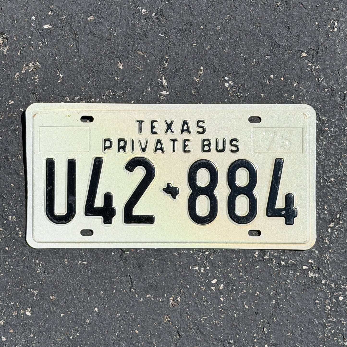 Photo of a 1975 Texas Bus License Plate Auto Tag Garage Decor Vintage Private U42 884 with original patina