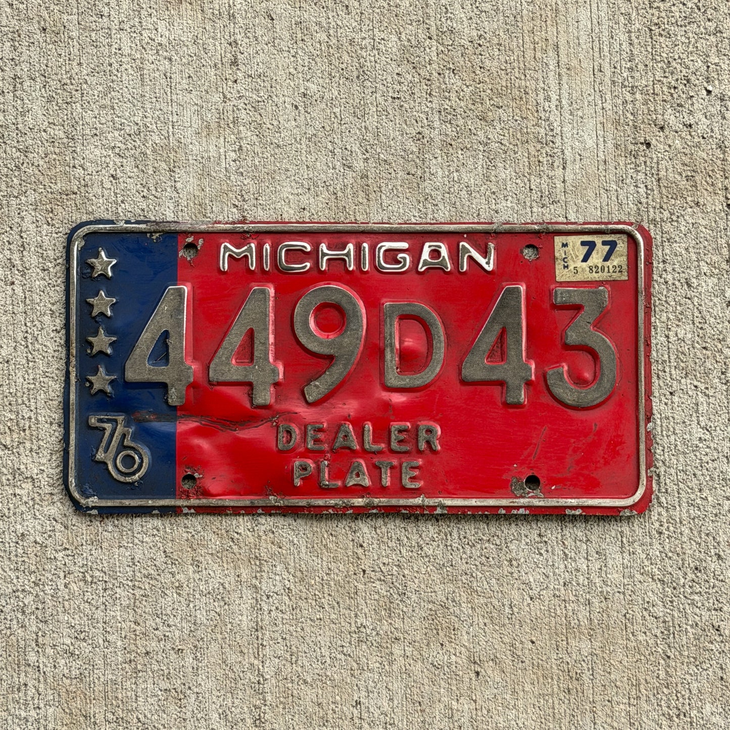 Photo of a 1976 1977 Michigan Dealer License Plate Auto Tag Garage Decor Vintage Bicentennial 449 D 43 with original patina