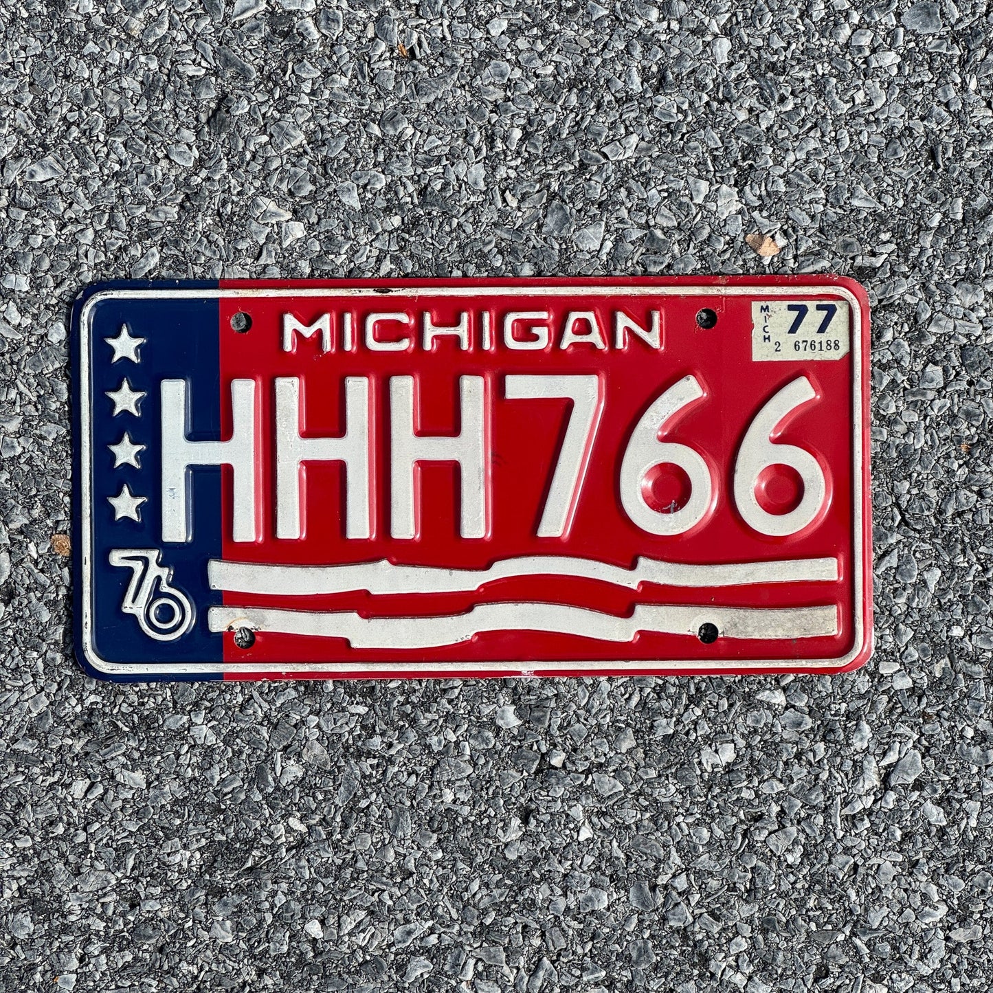 Photo of a 1976 1977 Michigan License Plate Auto Tag Garage Decor Vintage Repeat Repeating HHH 766