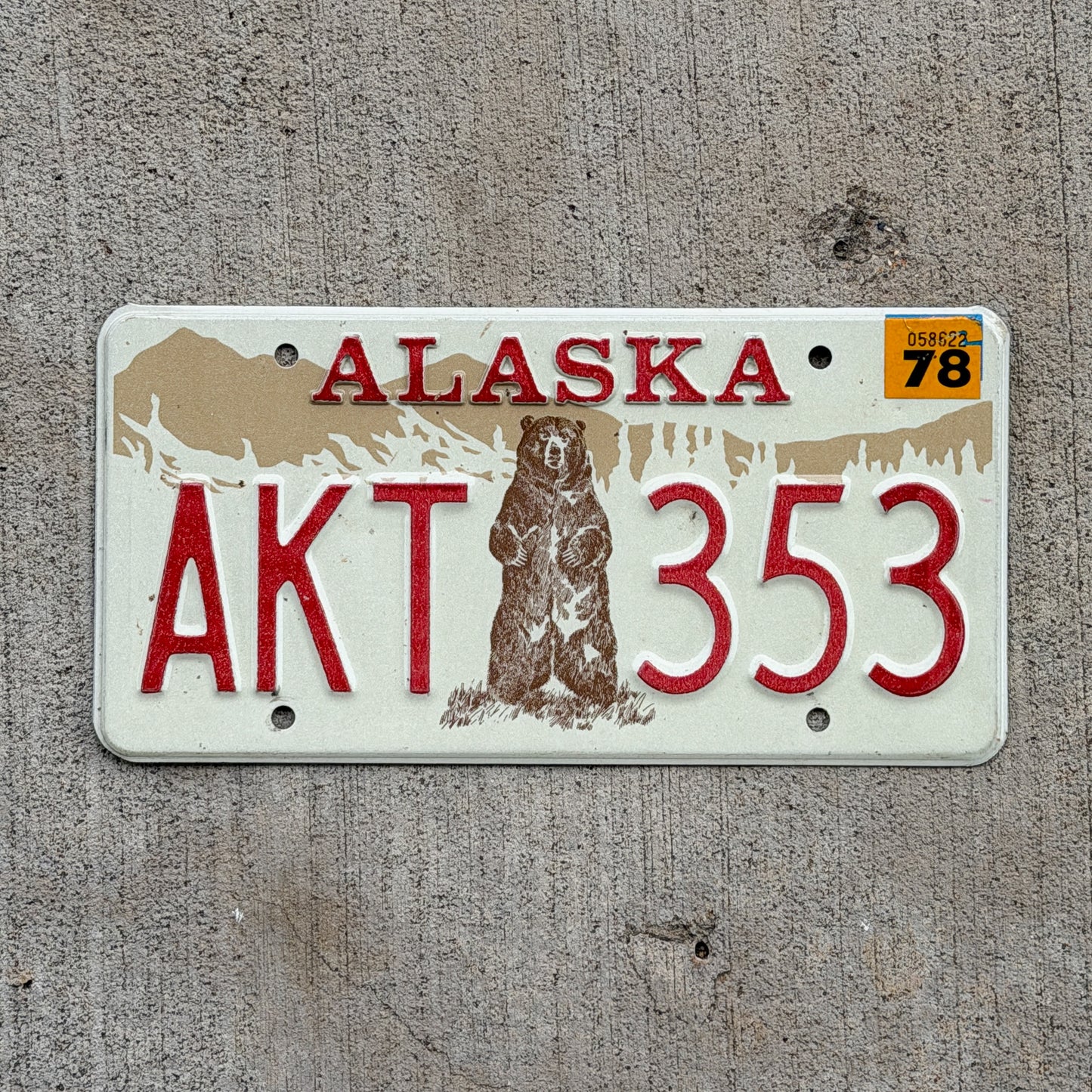 Photo of a 1976 1978 Alaska License Plate Auto Tag 1 Vintage Garage Bicentennial Bear AKT 353 with original patina
