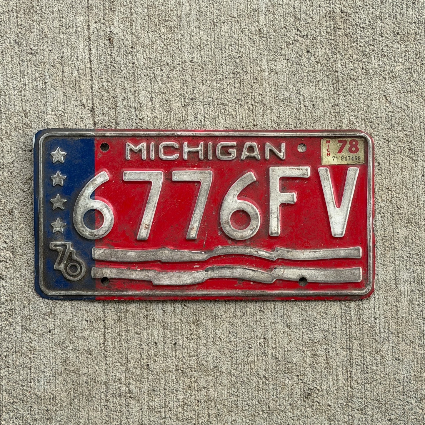 Photo of a 1976 1978 Michigan Commercial License Plate Auto Tag Garage Decor Vintage Bicentennial 6776 FV with original patina