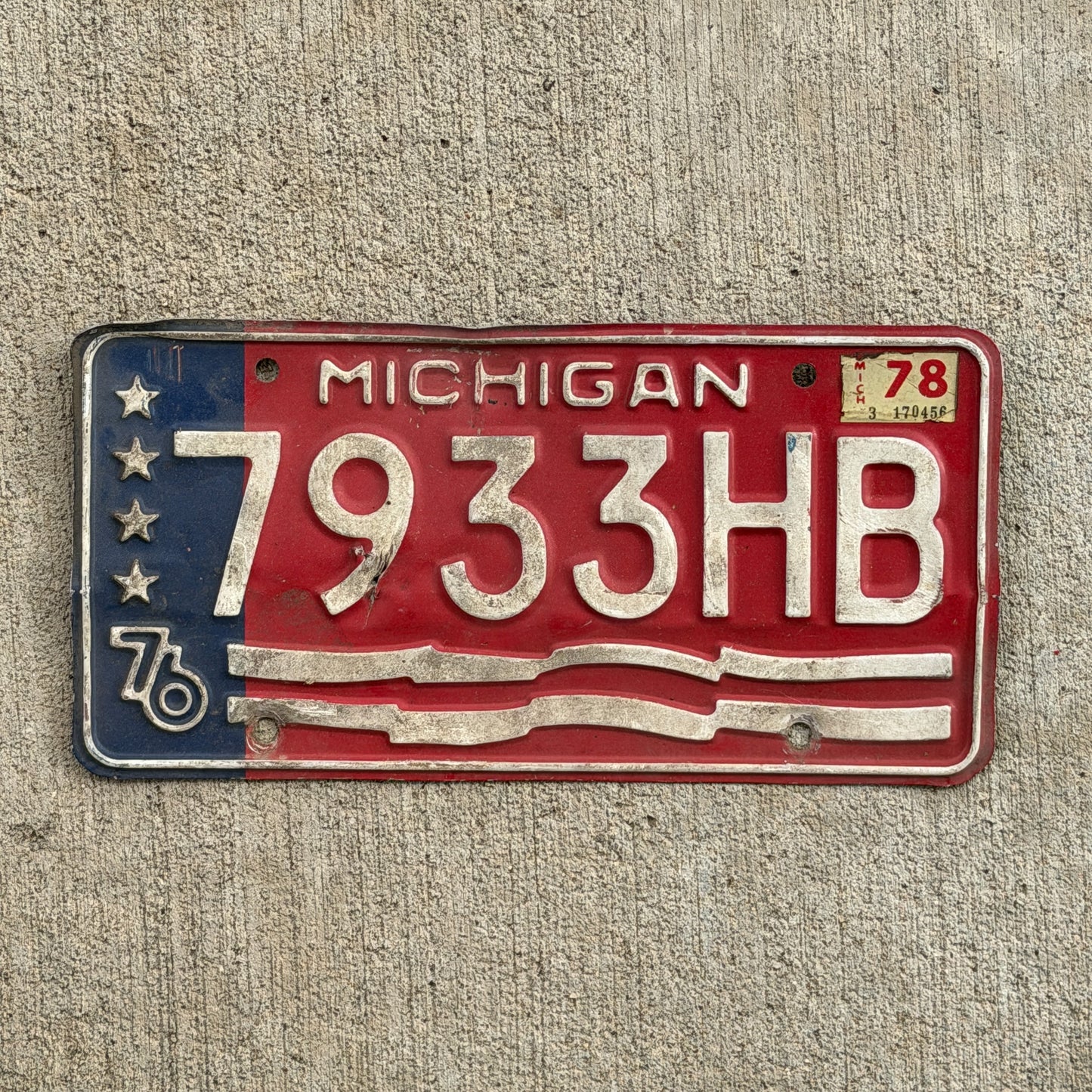 Photo of a 1976 1978 Michigan Commercial License Plate Auto Tag Garage Decor Vintage Bicentennial 7933 HB with original patina