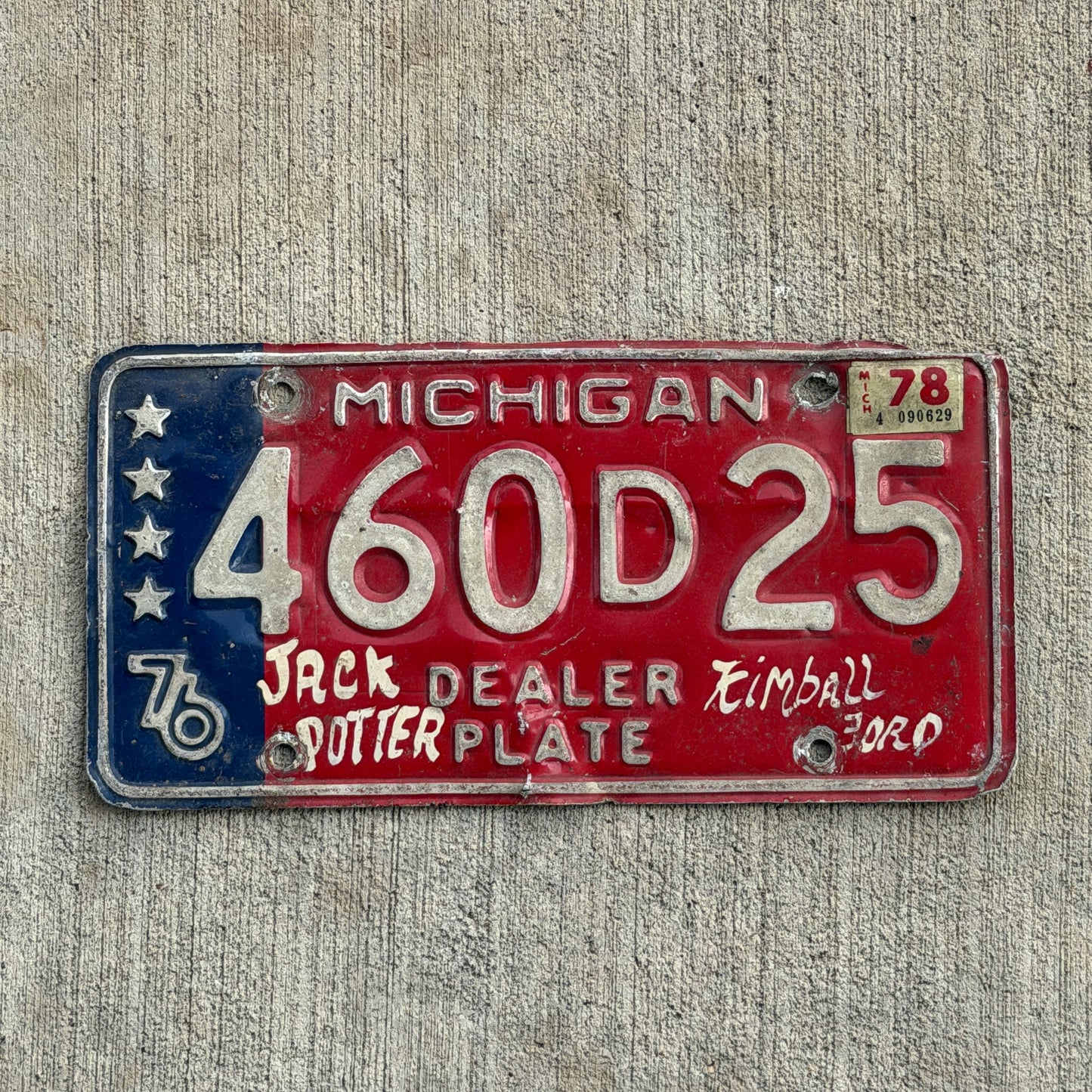 Photo of a 1976 1978 Michigan Dealer License Plate Auto Tag Garage Decor Vintage Bicentennial 460 D 25 with original patina