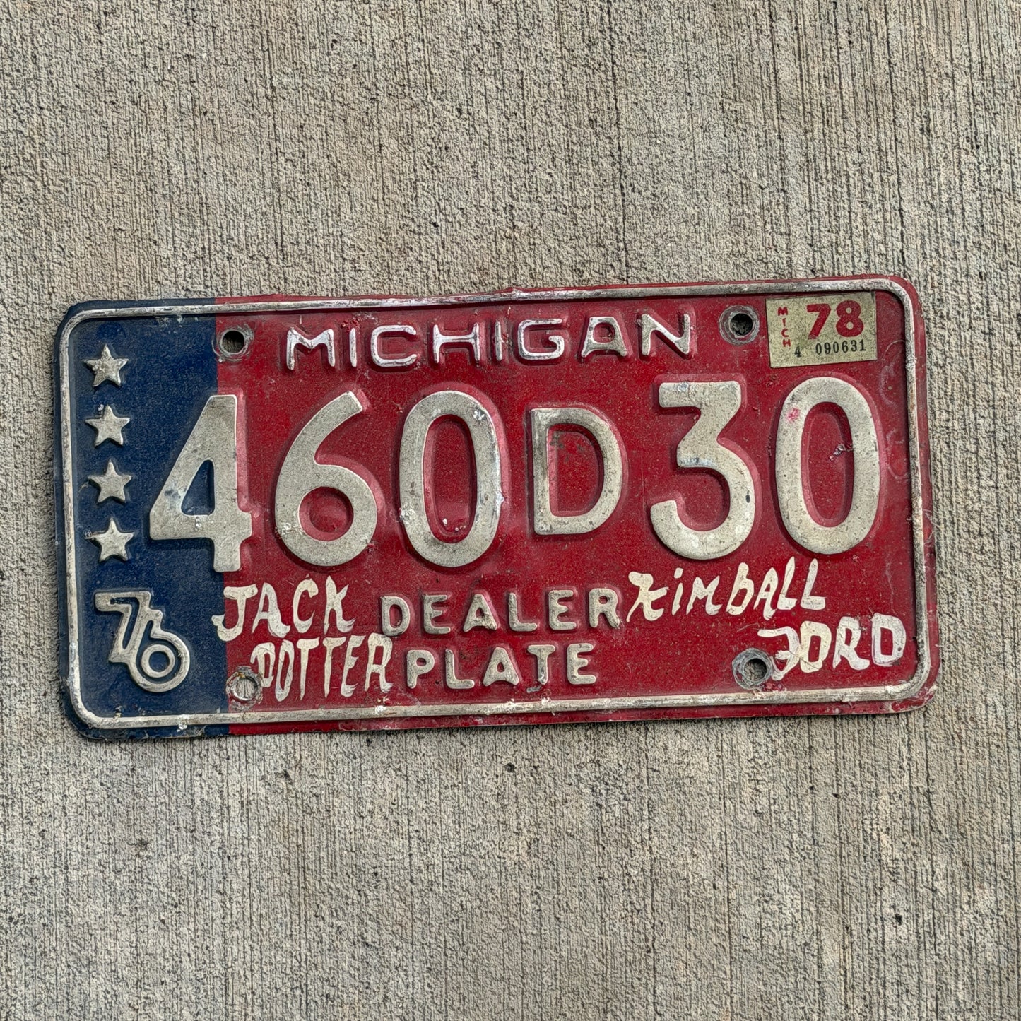Photo of a 1976 1978 Michigan Dealer License Plate Auto Tag Garage Decor Vintage Bicentennial 460 D 30 with original patina