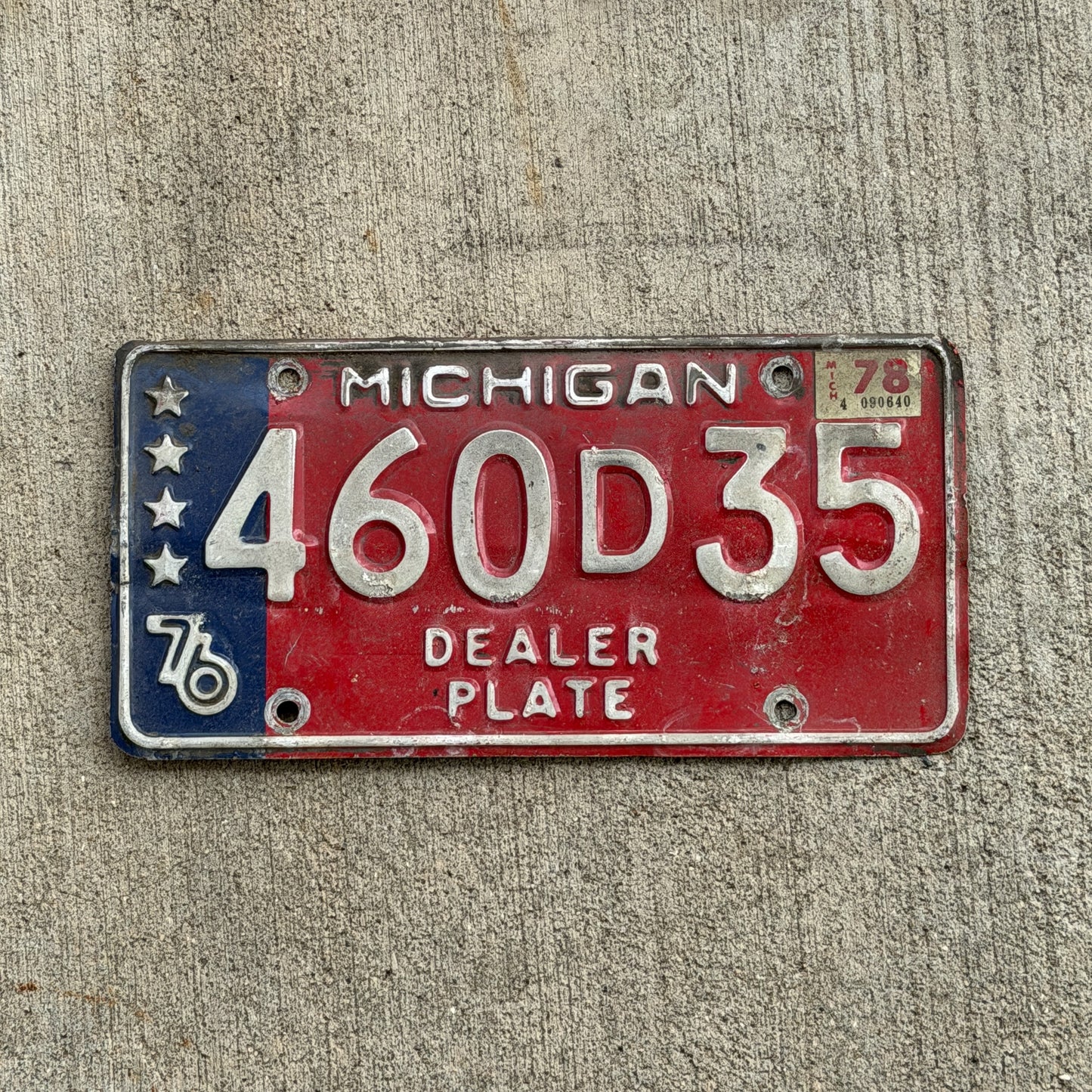 Photo of a 1976 1978 Michigan Dealer License Plate Auto Tag Garage Decor Vintage Bicentennial 460 D 35 with original patina