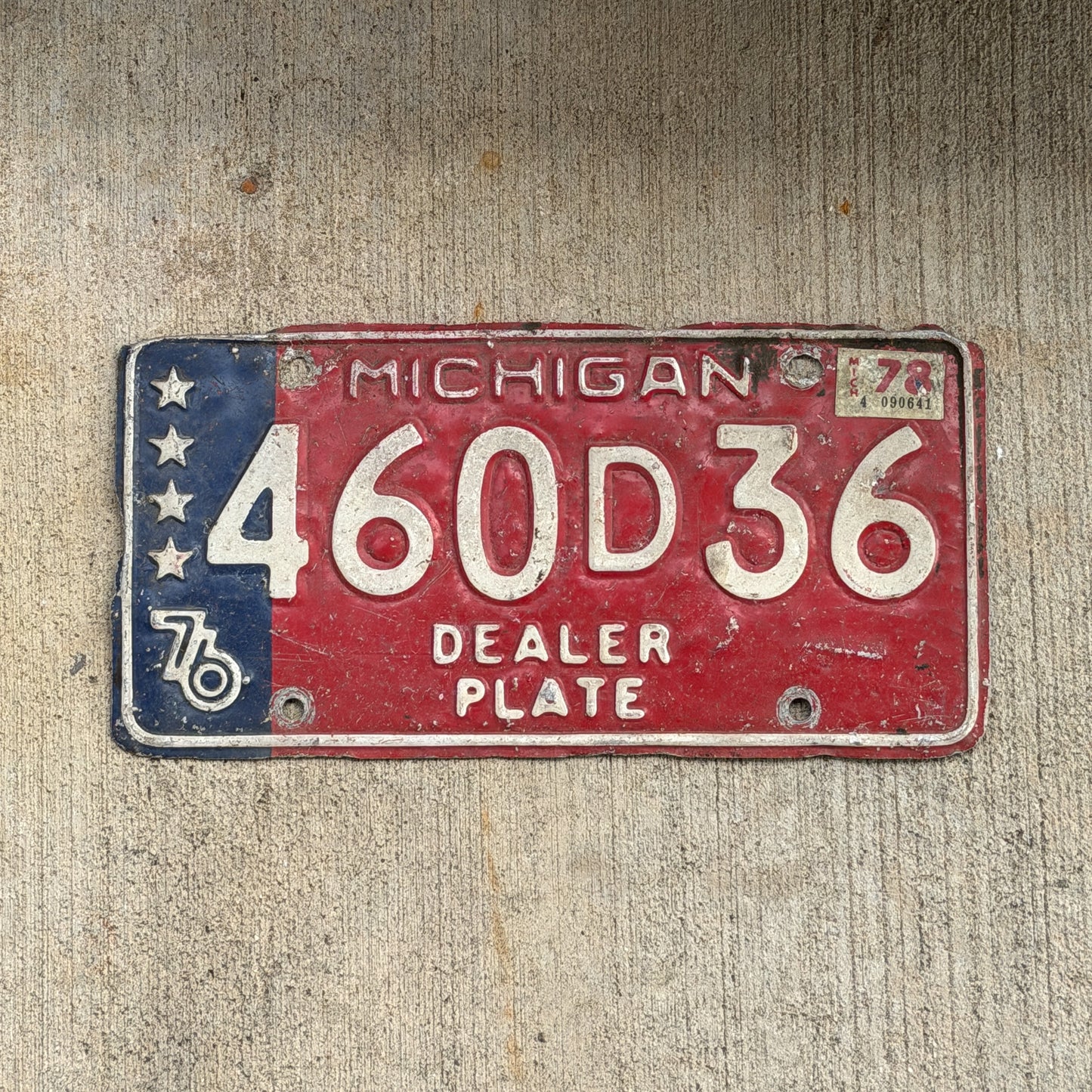 Photo of a 1976 1978 Michigan Dealer License Plate Auto Tag Garage Decor Vintage Bicentennial 460 D 36 with original patina