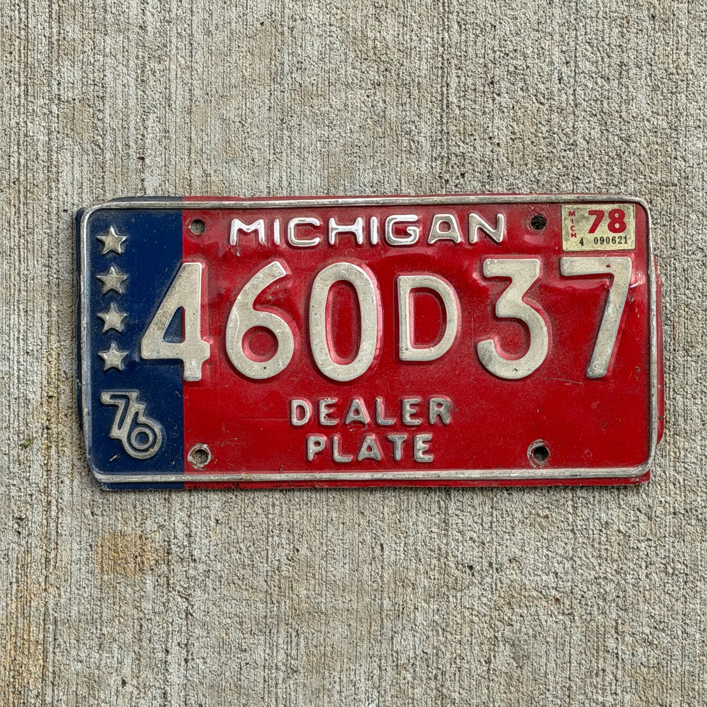 Photo of a 1976 1978 Michigan Dealer License Plate Auto Tag Garage Decor Vintage Bicentennial 460 D 37 with original patina