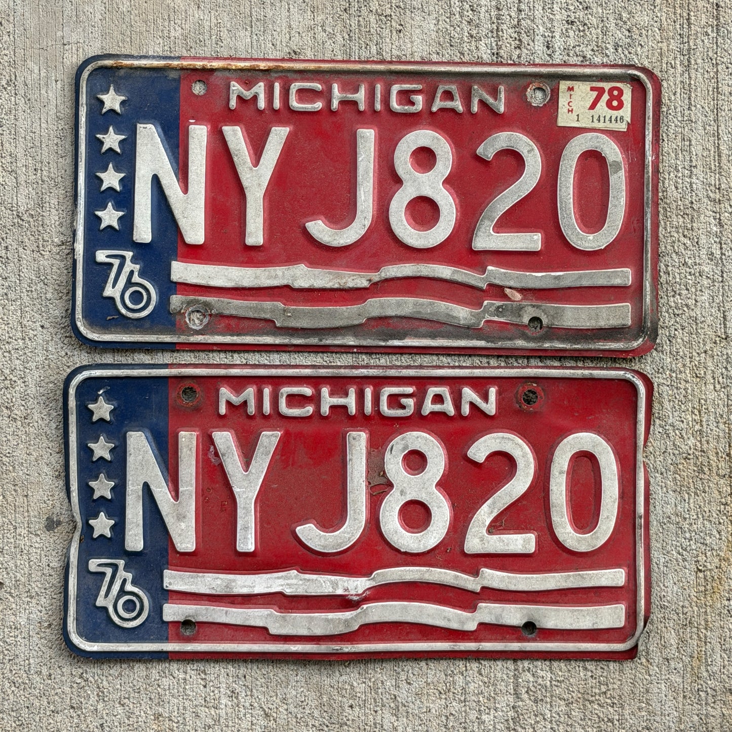 Photo of a 1976 1978 Michigan License Plate Pair Auto Tag Garage Decor Vintage Bicentennial NYJ 820 with original patina