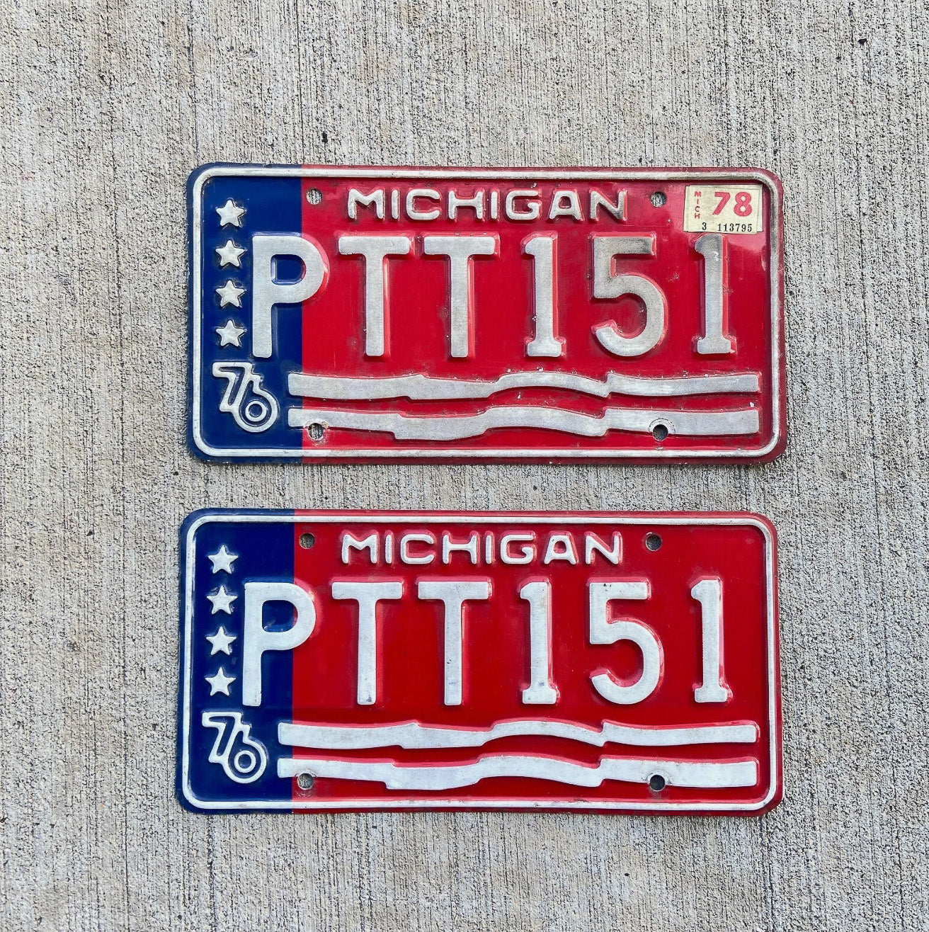 Photo of a 1976 1978 Michigan License Plate Pair Auto Tag Garage Decor Vintage Bicentennial PTT 151 with original patina