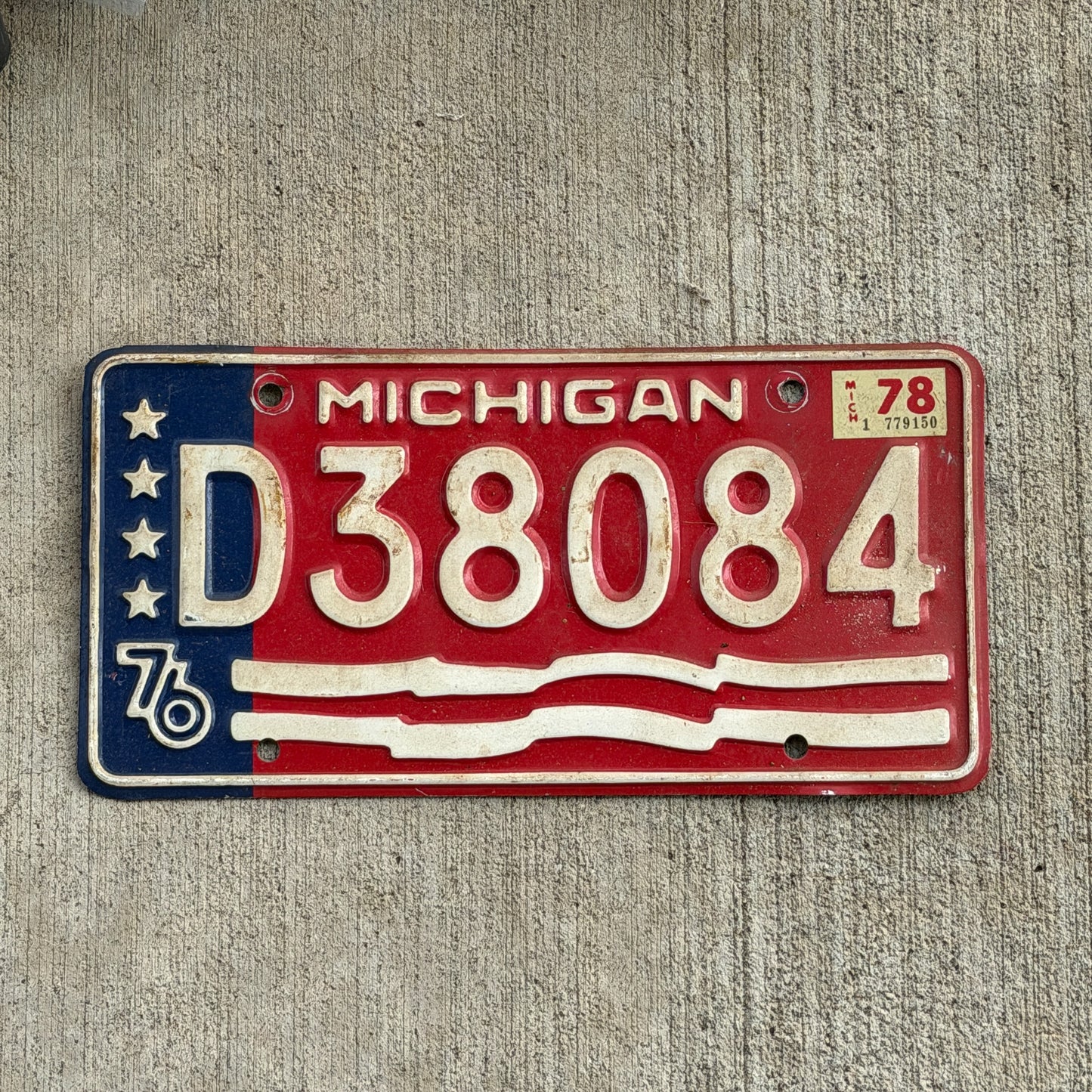 Photo of a 1976 1978 Michigan Trailer License Plate Auto Tag Garage Decor Vintage Bicentennial D 38084 with original patina