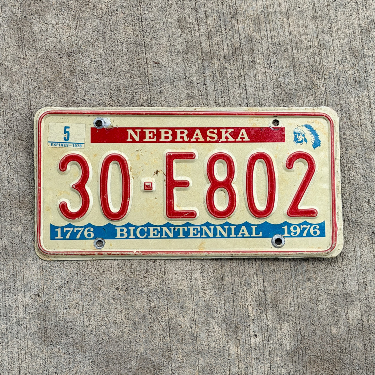 Photo of a 1976 1978 Nebraska License Plate Auto Tag Garage Decor Vintage Bicentennial 30 E802 with original patina
