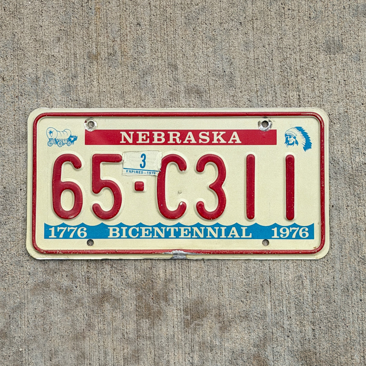 Photo of a 1976 1978 Nebraska License Plate Auto Tag Garage Decor Vintage Bicentennial 65 C311 with original patina