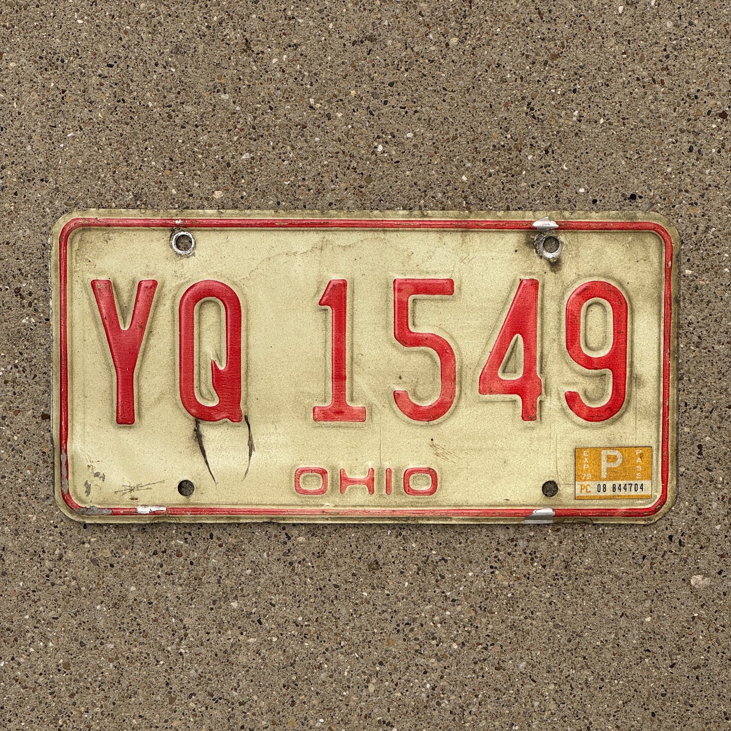 Photo of a 1976 1979 Ohio License Plate Auto Tag Garage Decor Vintage YQ 1549 with original patina
