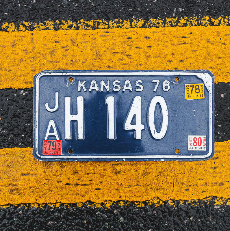 Photo of a 1976 1980 Kansas License Plate Auto Tag Garage Decor Vintage JA H 140 with original patina