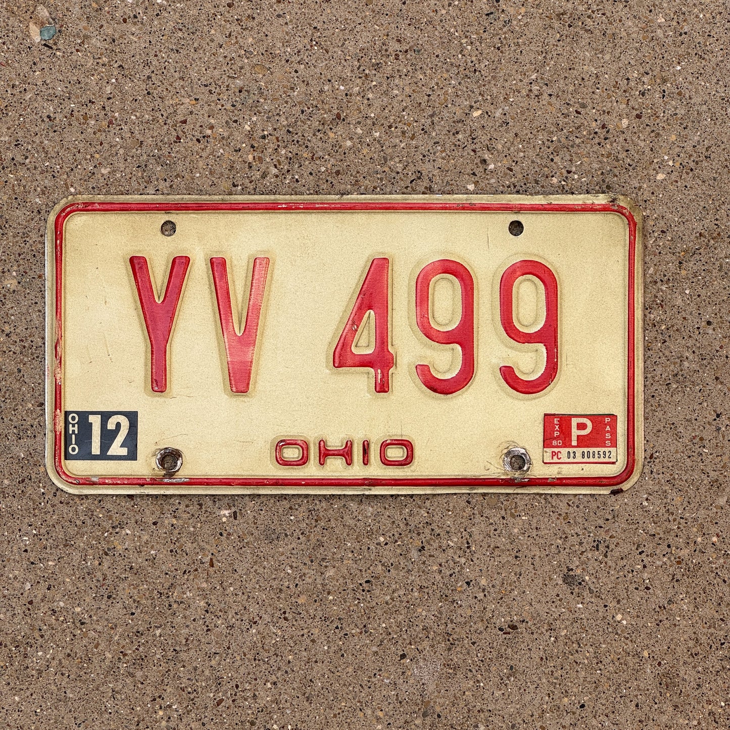 Photo of a 1976 1980 Ohio License Plate Auto Tag 1 Vintage Garage YV 499 with original patina