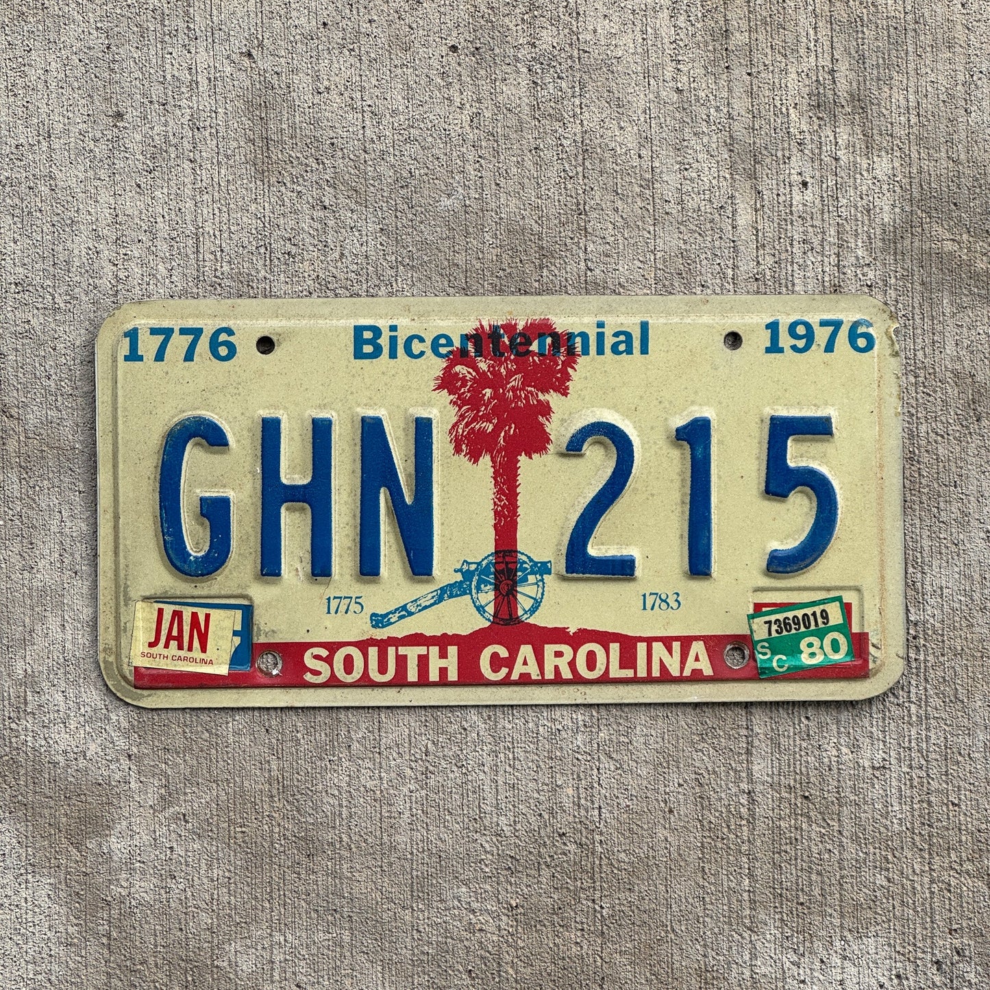 Photo of a 1976 1980 South Carolina License Plate Auto Tag Garage Decor Vintage Bicentennial GHN 215 with original patina
