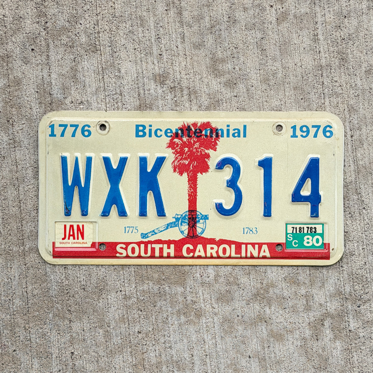 Photo of a 1976 1980 South Carolina License Plate Auto Tag Garage Decor Vintage Bicentennial WXK 314 with original patina